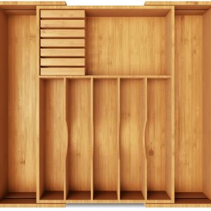 Expandable bamboo drawer organizer with removable knife block viewed empty from above with multiple storage compartments