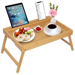 Bamboo breakfast tray with tablet holder, coffee and food, shown with folding legs on a white background