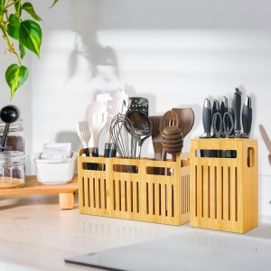 Wide three-compartment bamboo utensil holder beside a tall narrow holder displaying knives, scissors and cooking tools