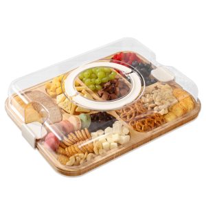 Bamboo charcuterie board filled with fruit, cheese and snacks under a transparent lid with white handle and clips