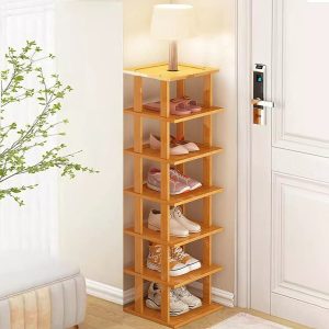 Bamboo shoe rack with seven shelf levels holding shoes below a top display surface beside a door