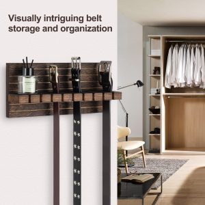 Wood belt organizer mounted beside a wardrobe with three belts hanging from its slotted rail