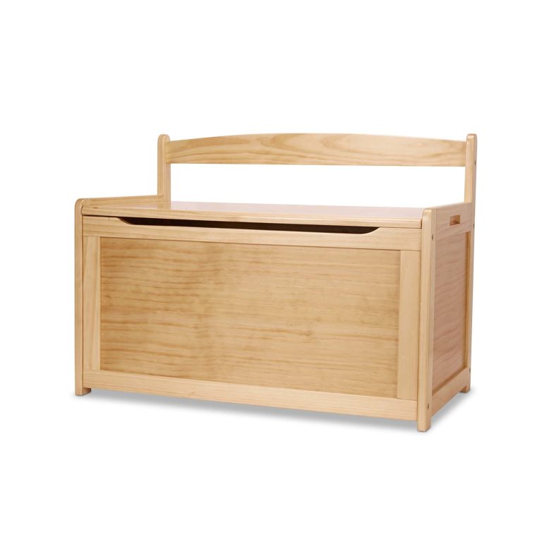 Wooden toy chest with a closed lid, side opening and upper rear rail against a white background