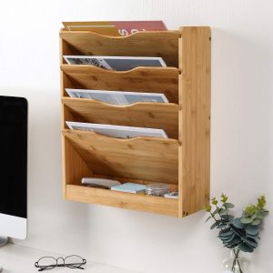 Bamboo wall file organizer with four angled file pockets and a separate bottom tray holding stationery