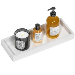 White rectangular vanity tray shown with toiletries and a display candle