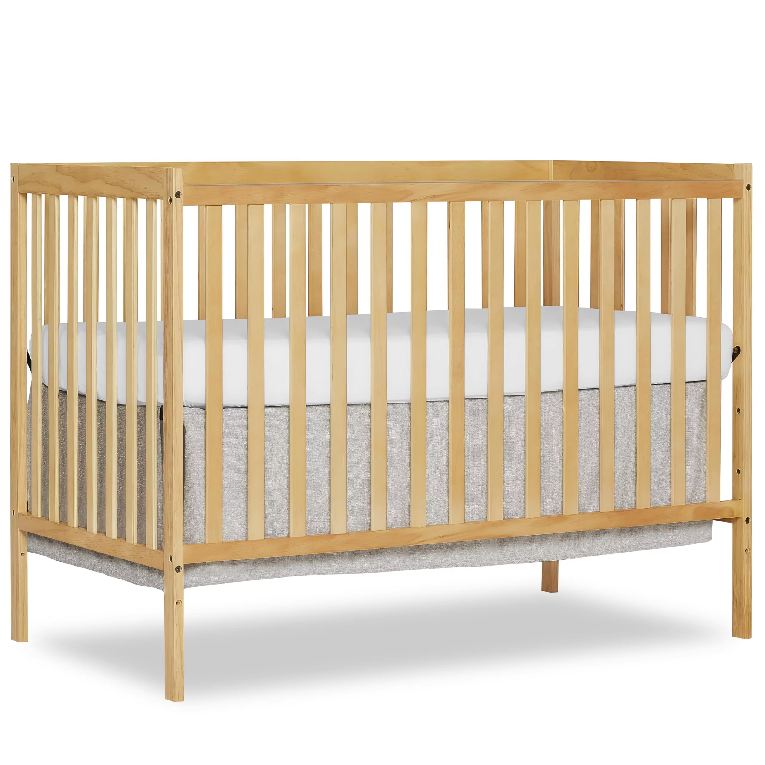 Wooden crib with a natural-toned rectangular frame, vertical slats and straight corner posts, shown with a mattress against a white background
