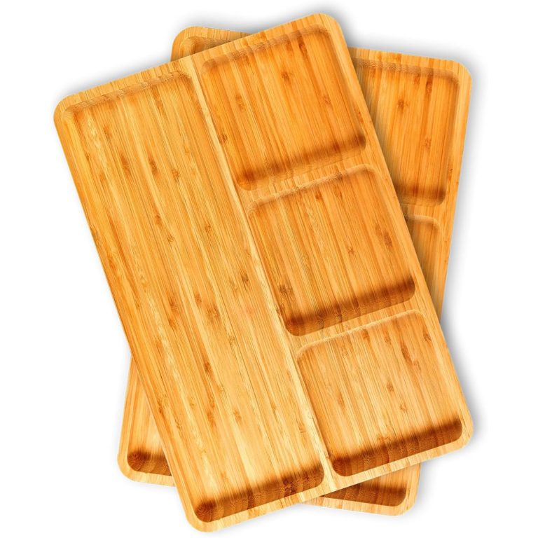 Two empty bamboo serving trays showing rounded corners, raised dividers and four recessed compartments