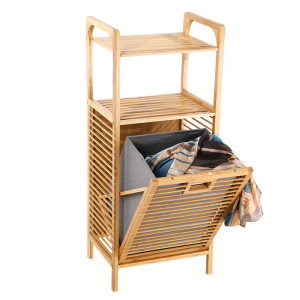 Bamboo laundry basket organizer with two upper slatted shelves and a lower gray fabric bin tilted forward beneath a plain cutout handle