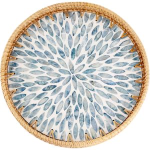 Round rattan tray with light blue mother of pearl leaf inlay and a natural woven rim on a white background