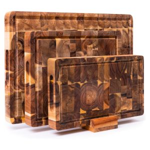 Three acacia wood cutting boards with block-pattern surfaces, juice grooves and recessed side grips