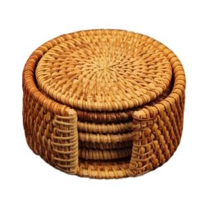 Round handwoven rattan coasters stacked in a matching open-front woven holder on a white background