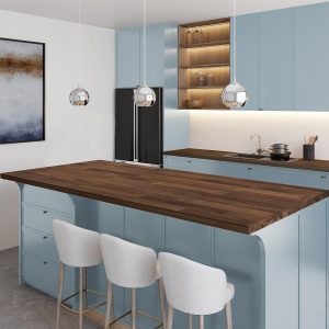 Acacia butcher block countertop in a dark walnut tone on a kitchen island with pale blue cabinets