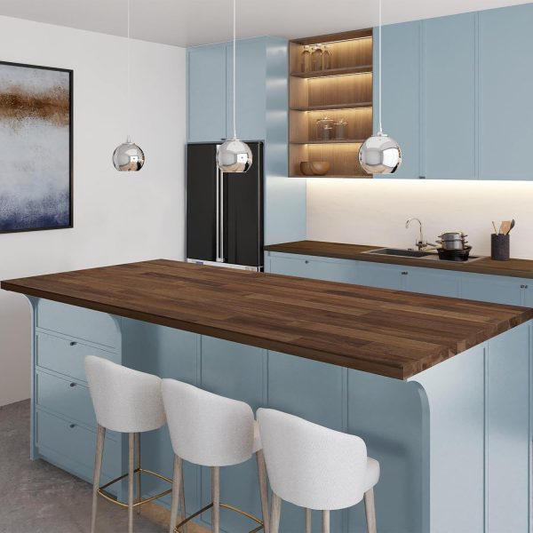 Acacia butcher block countertop in a dark walnut tone on a kitchen island with pale blue cabinets