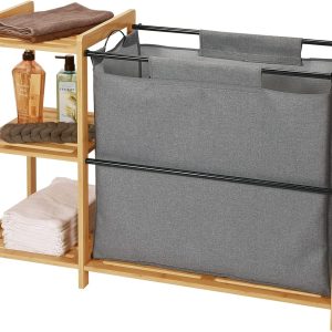 Bamboo laundry hamper with a large gray fabric bag, black support rails and three open side shelves