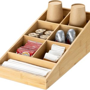 Bamboo coffee station organizer with seven compartments holding paper cups, tea bags, creamer portions and wrapped stirrers