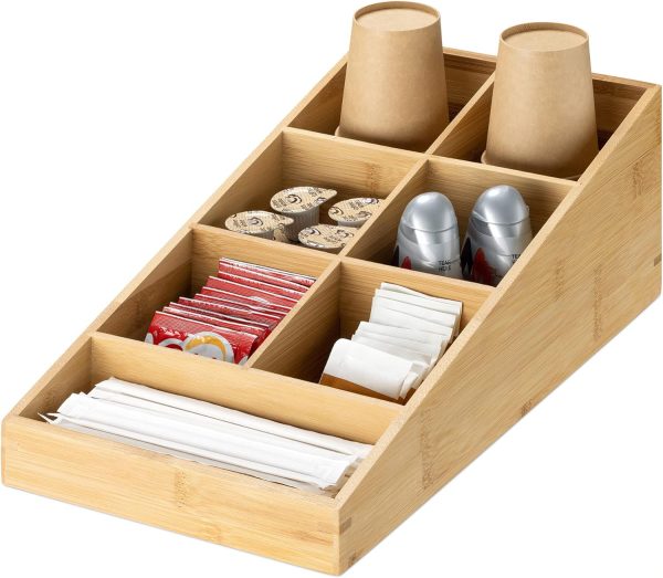 Bamboo coffee station organizer with seven compartments holding paper cups, tea bags, creamer portions and wrapped stirrers
