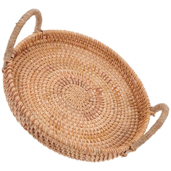 Angled top view of a round woven rattan tray with two raised loop handles