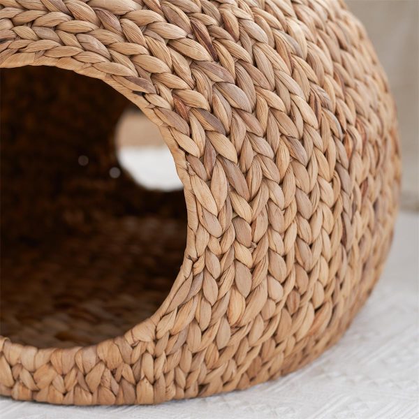 Close-up of the water hyacinth weave and bound edge around the cat cave entrance