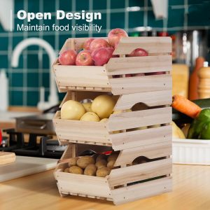 Three stacked wood potato onion storage bins holding apples, lemons and potatoes on a kitchen counter