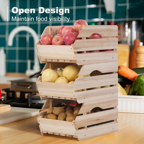 Three stacked wood potato onion storage bins holding apples, lemons and potatoes on a kitchen counter