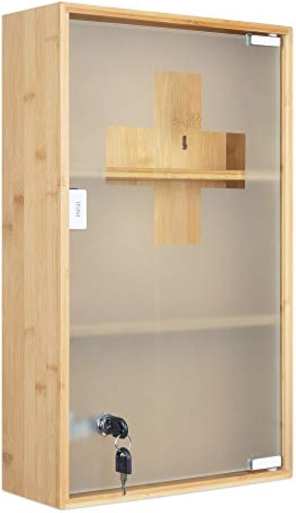 Front detail of a vertical bamboo medicine cabinet with frosted glass door, cross motif, key lock and two internal shelves