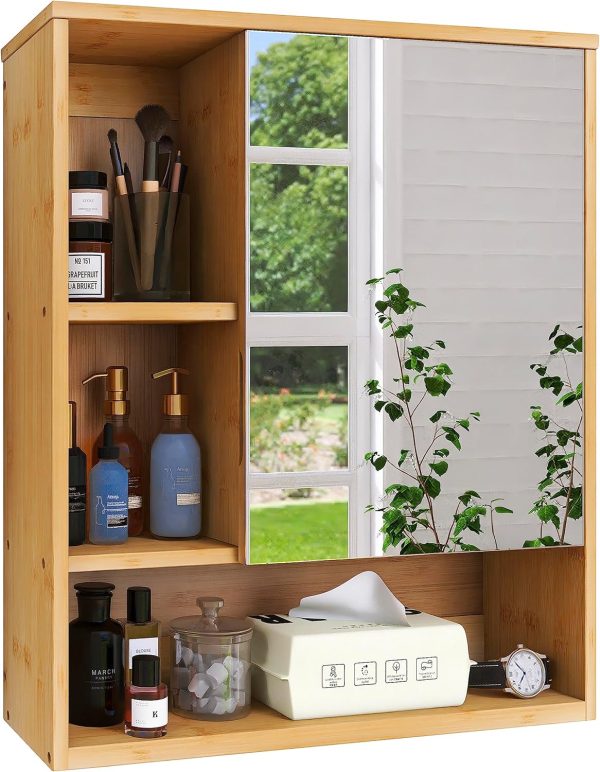 Front detail of a bamboo bathroom mirror cabinet with closed mirror door, two open left compartments and a bottom shelf holding toiletries