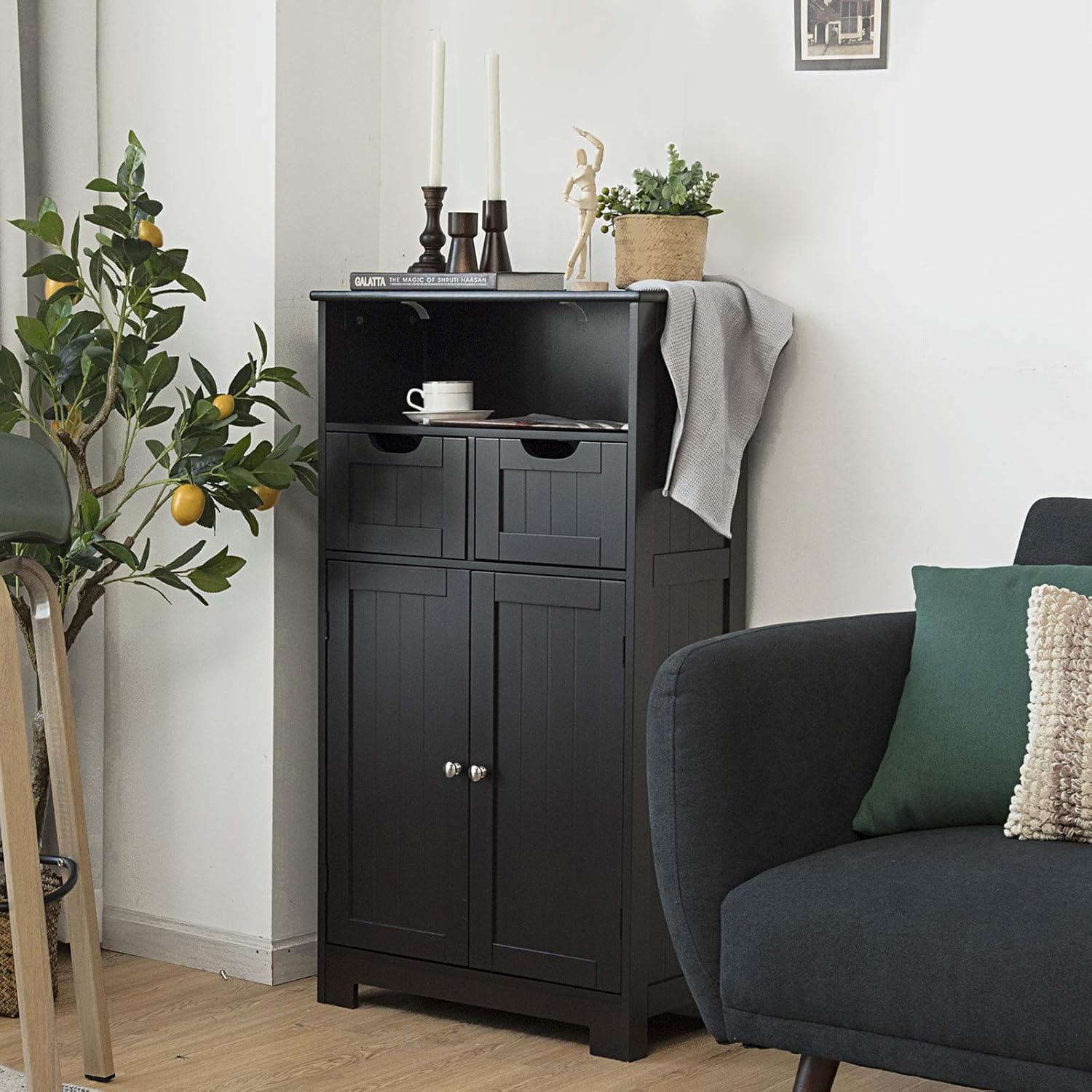 Black freestanding bathroom cabinet with open shelf and drawers